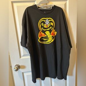 Cobra Kai 3X Men’s Graphic Short Sleeve Tee Yellow Red White Cobra Snake Logo